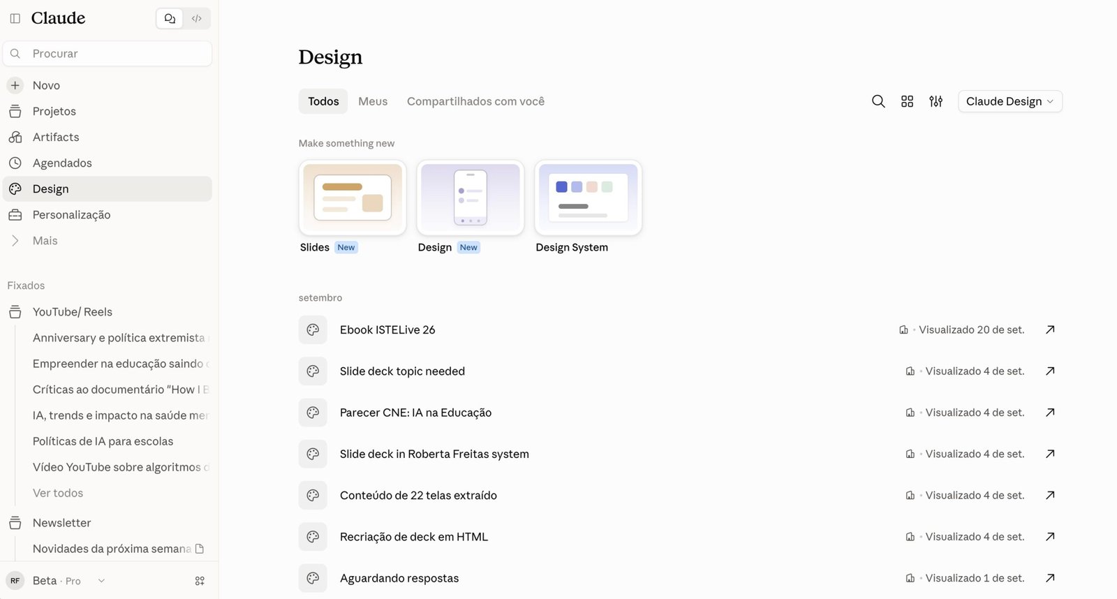 Print da seção Design do Claude mostrando as opções 'Slides', 'Design' e 'Design System' para criar algo novo, com uma lista de apresentações criadas em setembro, como 'Ebook ISTELive 26' e 'Slide deck in Roberta Freitas system'.